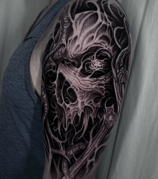 Big Blackwork Skull and Tentacles Tattoo on Men Upper Arm by @tommyconstantinou