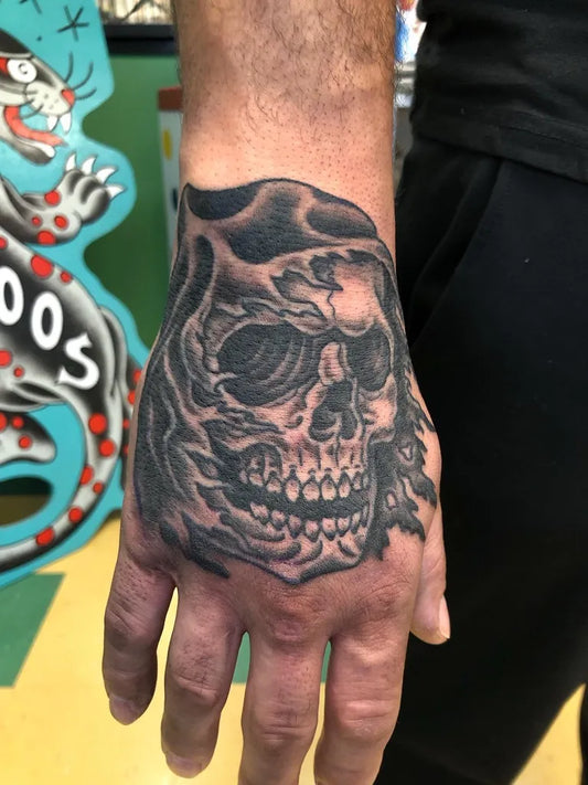 Big Blackwork Skull on Men Hand Tattoo by @janman_tattoos