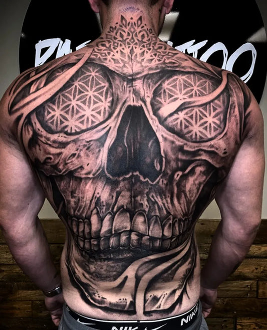 Big Blackwork Skull with Flower of Life Eyes on Men Back Tattoo by @pablotattoo8