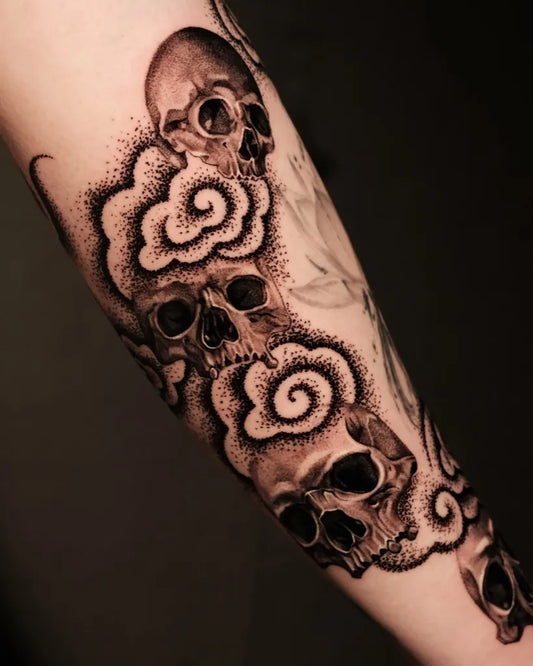 Big Blackwork Skulls and Cloud Tattoo on Men Arm by @a_youngg_____