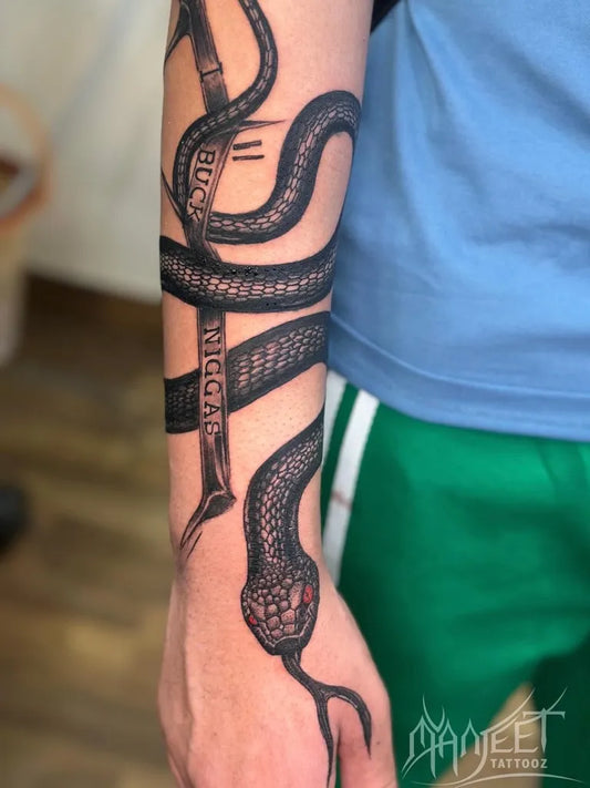 Big Blackwork Snake Cross on Men Arm Tattoo by @manjeettattooz
