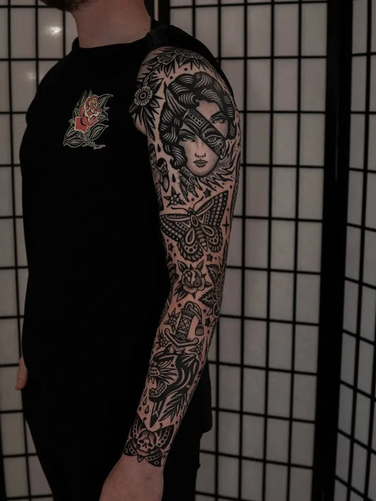 Big Blackwork Snake Geisha Moth Tattoo on Men Arm by @traditionalstattoos