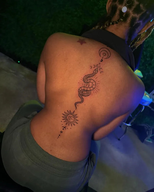 Big Blackwork Snake Sun Spine on Women Tattoo by @kingtattoos