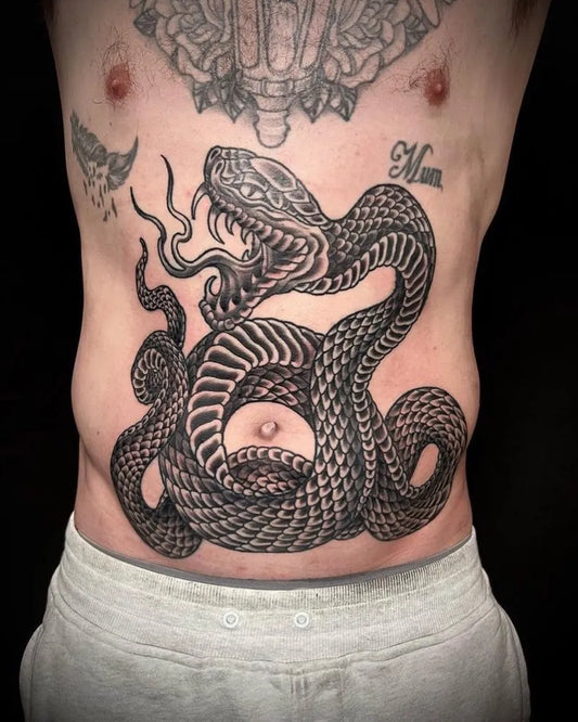 Big Blackwork Snake Tattoo on Men Stomach by @jettyroadtattoo