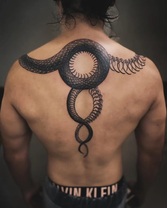Big Blackwork Snake and Circles on Men Back Tattoo by @ahn_ttt