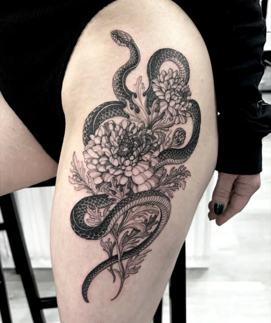 Big Blackwork Snake and Dahlia on Women Thigh Tattoo by @yongjuntattoo