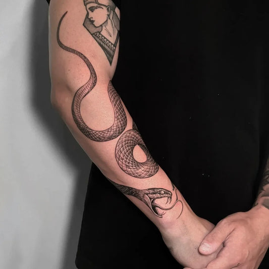 Big Blackwork Snake and Egyptian Profile on Men Arm Tattoo by @artbus.tattoo