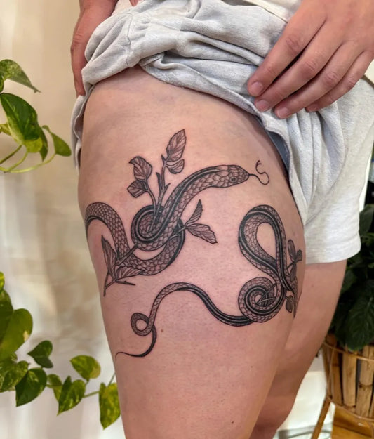 Big Blackwork Snake and Leaves on Women Thigh Tattoo by @bekmurrell