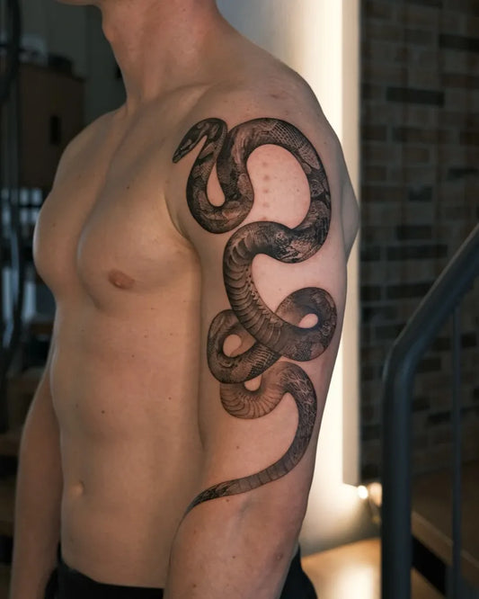 Big Blackwork Snake on Men Arm Tattoo by @choseung.ink.22