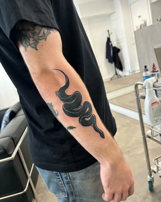 Big Blackwork Snake on Men Arm Tattoo by @zerokid_tattoo