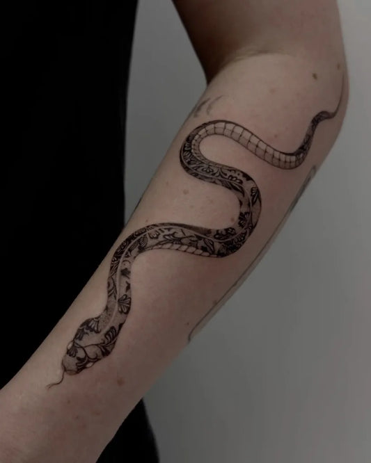 Big Blackwork Snake on Women Arm Tattoo by @madame.ink.art