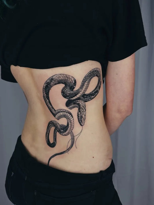 Big Blackwork Snakes on Women Back Tattoo by @expression_ink_