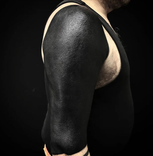 Big Blackwork SolidBlackSleeve Tattoo on Men Upper Arm by @mikevantattoo