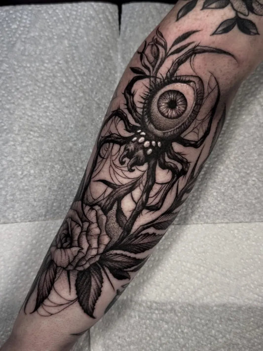 Big Blackwork Spider Eye Rose on Women Arm Tattoo by @hadesgravetattoos