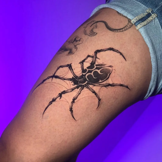 Big Blackwork Spider with Cloud and Snake on Women Thigh Tattoo by @tisha.tattoo