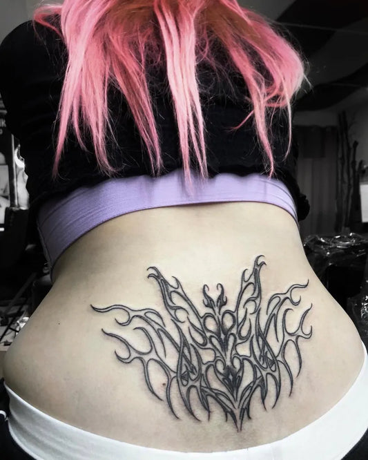 Big Blackwork Spiky Floral Wings Tattoo on Women Lower Back by @tatt00edslut