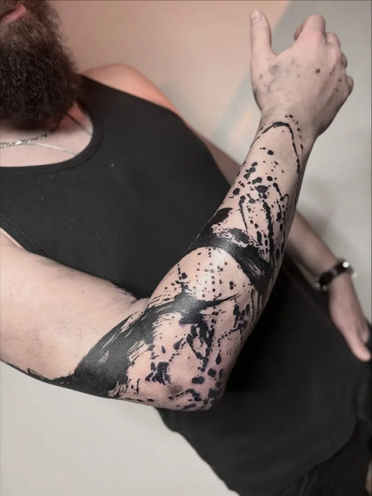 Big Blackwork Splatter Tattoo on Men Arm by @tonytuanluong