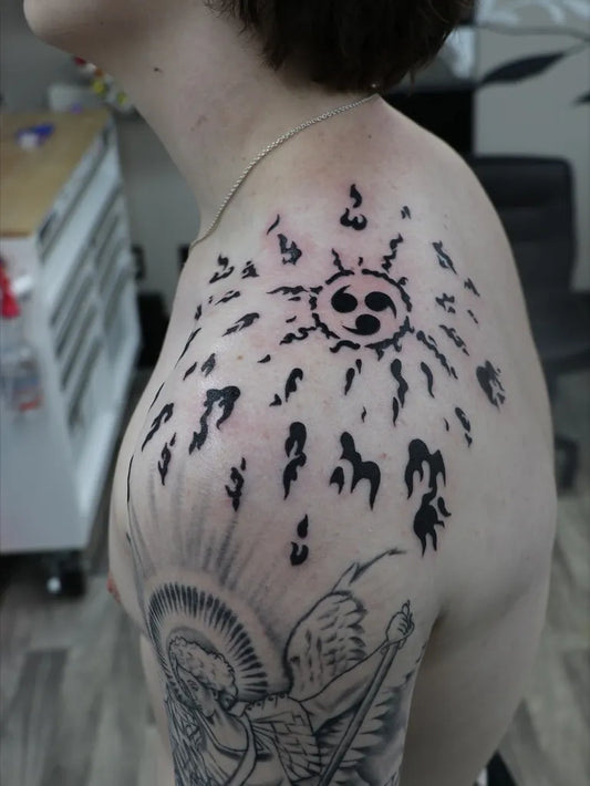 Big Blackwork Sunburst with Tomoe and Angel on Men Shoulder Tattoo by @yesart101