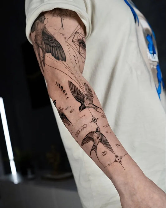 Big Blackwork Swallow and Compass Tattoo on Men Arm by @the.xx.ttt