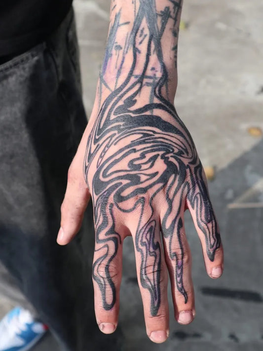 Big Blackwork Swirling Lines on Men Hand Tattoo by @tattoo_gast