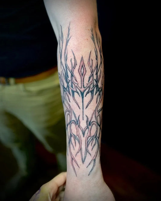 Big Blackwork Thorn Spikes Crown on Men Forearm Tattoo by @emma_kudos.tattoo