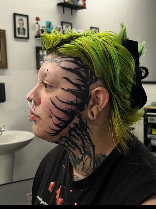 Big Blackwork Thorns on Women Face Tattoo by @ink.spot.studio