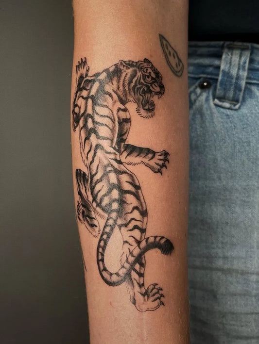 Big Blackwork Tiger with Claw Mark on Women Arm Tattoo by @finelinecosmetics.tattoo