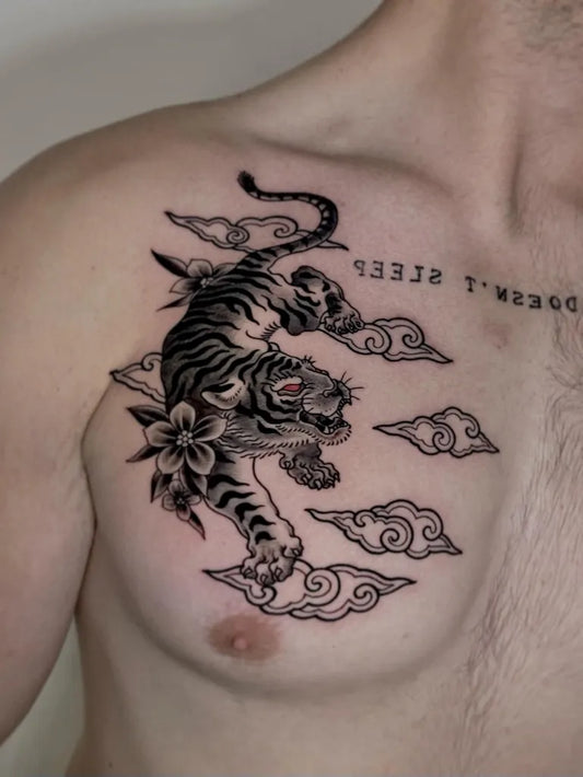 Big Blackwork Tiger with Clouds and Flowers on Men Chest Tattoo by @yantinotattoo_ubud