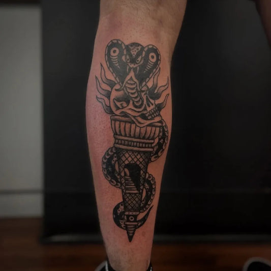 Big Blackwork Torch and Cobra Tattoo on Men Calf by @southwesttattoostudio