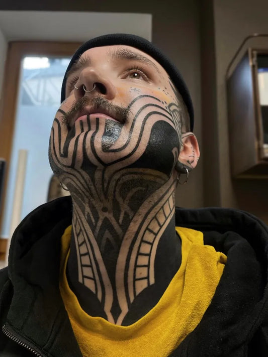 Big Blackwork Tribal Patterns Tattoo on Men Face by @melissa.hils