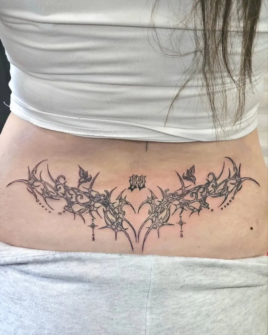 Big Blackwork Tribal Vines Tattoo on Women Lower Back by @9thgategallery