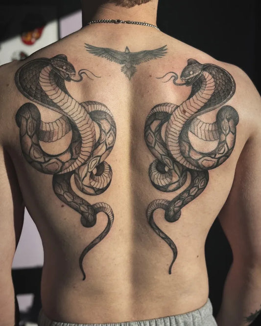 Big Blackwork Twin Cobras and Eagle on Men Back Tattoo by @melaniekeat_tattoo