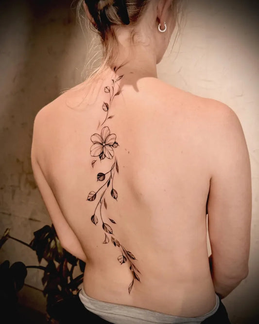 Big Blackwork Vine Flower on Women Back Tattoo by @86.inked
