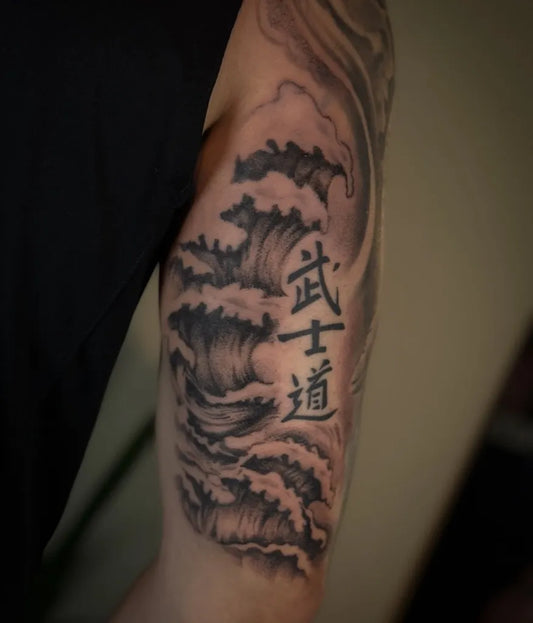 Big Blackwork Waves and Chinese Characters Tattoo on Men Upper Arm by @vz.ink