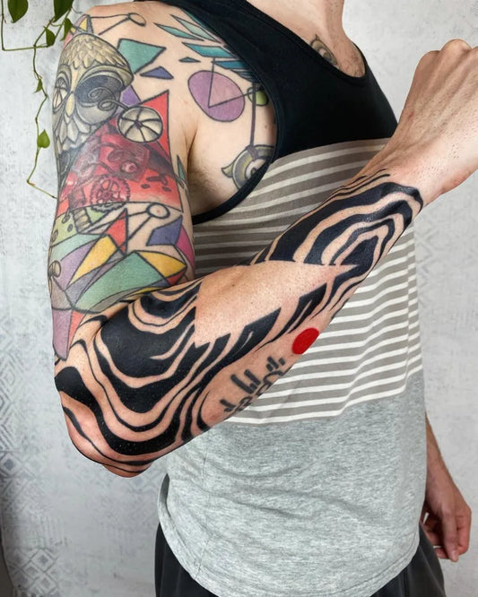 Big Blackwork Wavy Lines and Red Dot Tattoo on Men Upper Arm by @unbound.ink