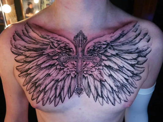 Big Blackwork Winged Cross on Men Chest Tattoo by @buddytattoos