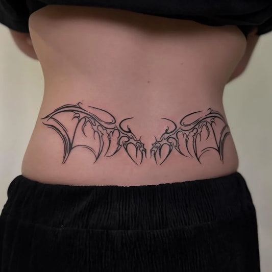 Big Blackwork Wings Tattoo on Women Lower Back by @diiv4n