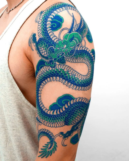 Big Blue Dragon Tattoo on Men Arm by @nobodytattoo