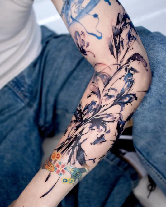 Big Blue Floral Splash Tattoo on Women Arm by @hongcha_tt