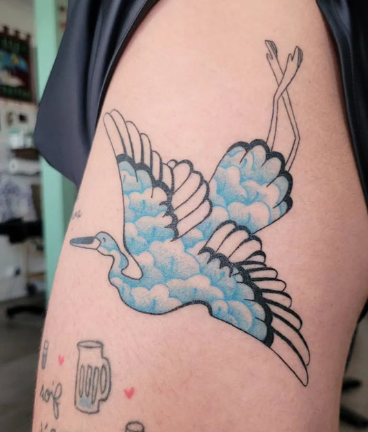 Big Blue Heron with Clouds Tattoo on Women Thigh by @gladystomeetyou