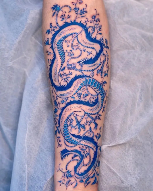 Big Blue Twin Dragons Tattoo on Women Arm by @inklarity_official