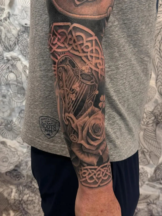 Big Celtic Harp Roses Knots Tattoo on Men Arm by @thekidevantattoos