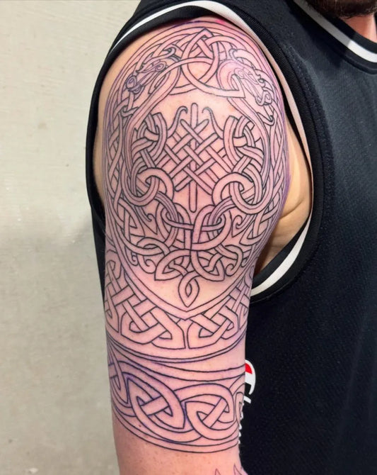 Big Celtic Knot and Dragon Tattoo on Men Upper Arm by @blackhart.tattoo