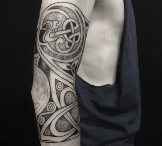 Big Celtic Knot and Spiral Design Tattoo on Men Arm by @kaleidoscopetattoostudio