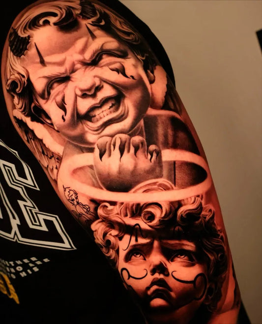 Big Chicano Angry Cherub with Halo and Rosary Tattoo on Men Arm by @mb_tattooer