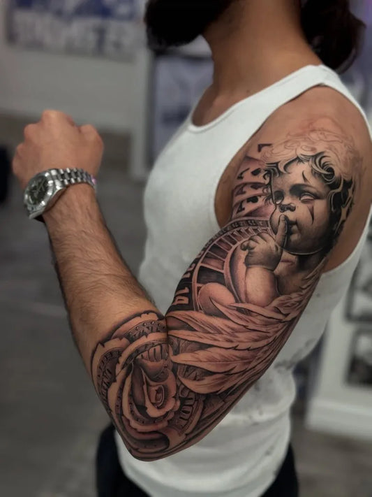 Big Chicano Cherub Gear Ribbon Tattoo on Men Arm by @inkbyry