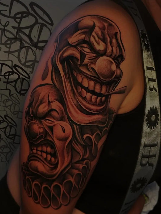 Big Chicano Dual Clown Masks Tattoo on Men Arm by @drop_letras