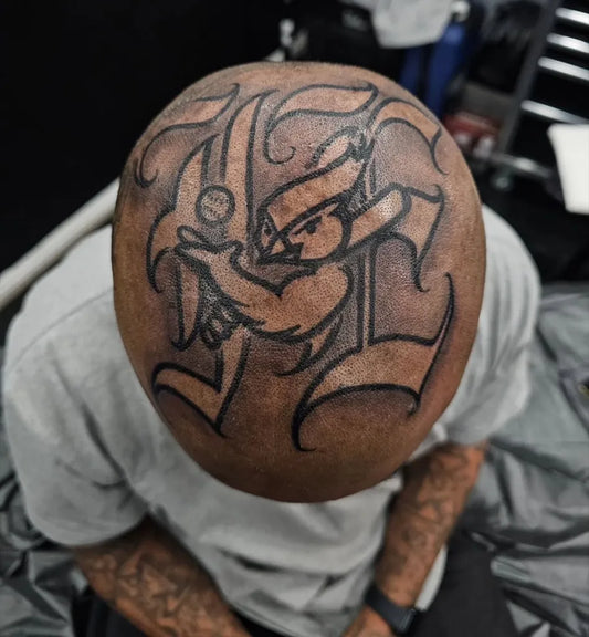 Big Chicano Letter L with Baseball Player Tattoo on Men Head by @fatboy562ink