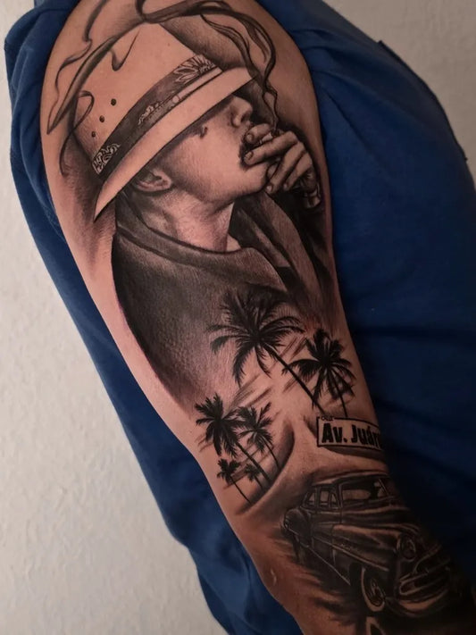 Big Chicano Man with Hat Portrait and Palmtree Car Tattoo on Men Arm by @ludwika.tefnut.tattoo