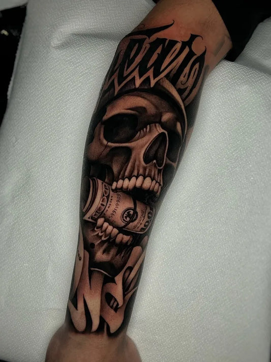 Big Chicano Skull with Money and Travis Name Tattoo on Men Arm by @mrsourtattoo